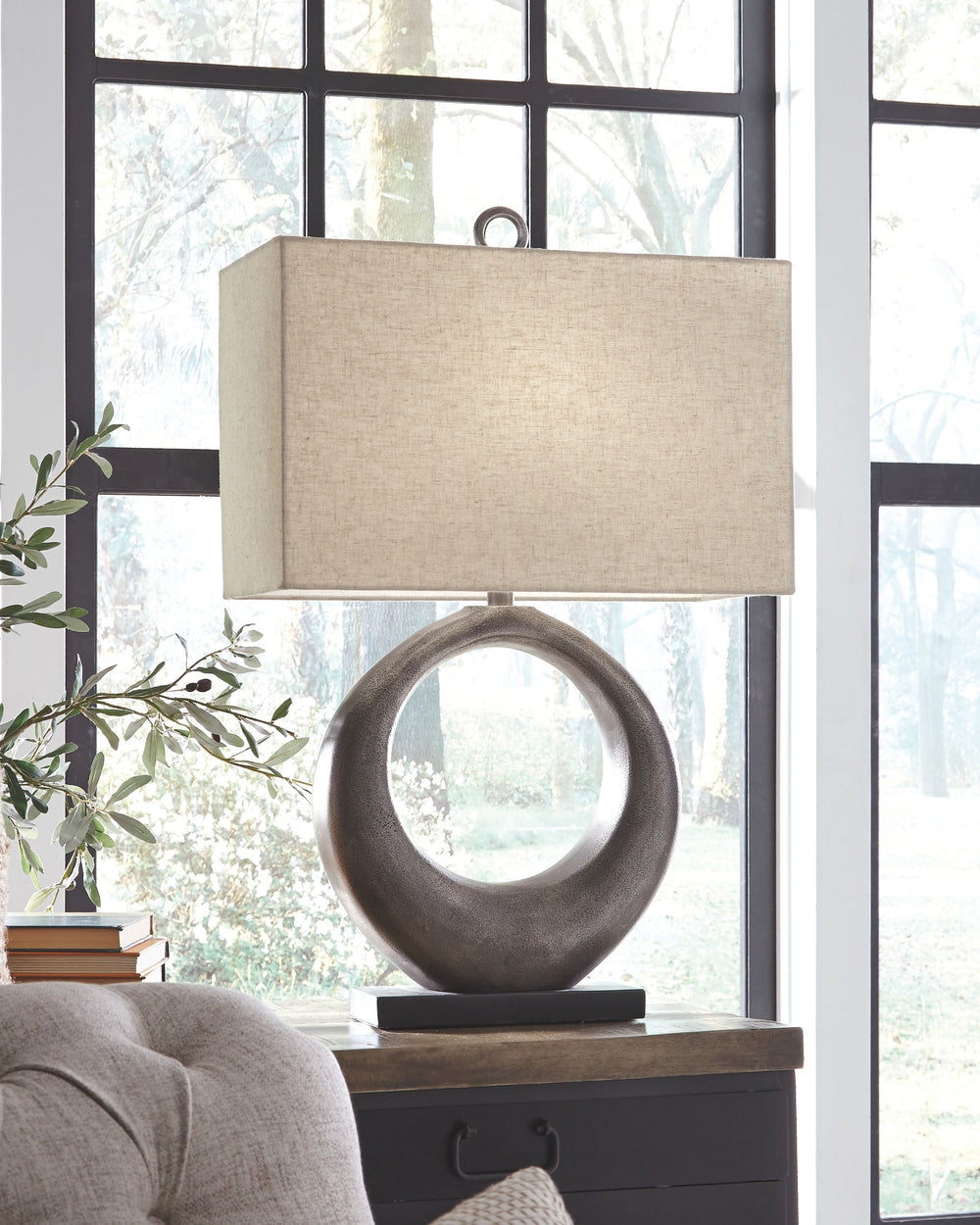 Part sculpture and totally beautiful, this table lamp lets you delight in the art of lighting. The aesthetic may be contemporary and refined, but its antique silvertone cast aluminum infuses a raw element for beautiful balance.<br><br><b>Additional Dimens