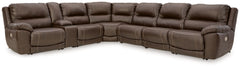 Load up on comfort in a cool, clean-lined and contemporary way with this power reclining sectional in chocolate brown. Rest assured, the expertly matched leather and faux leather upholstery is enriched with a pebble grain effect for authentic appeal and e