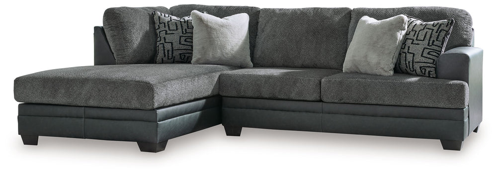 Appeal to your eye for ultra-contemporary design with this sectional. Chic and sleek in dark neutrals, it pairs cozy fabric with faux leather for invitingly cool character. And with a roomy chaise offering extra seating space, family and friends can chill