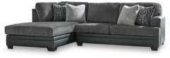 Appeal to your eye for ultra-contemporary design with this sectional. Chic and sleek in dark neutrals, it pairs cozy fabric with faux leather for invitingly cool character. And with a roomy chaise offering extra seating space, family and friends can chill
