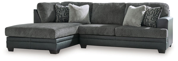 Appeal to your eye for ultra-contemporary design with this sectional. Chic and sleek in dark neutrals, it pairs cozy fabric with faux leather for invitingly cool character. And with a roomy chaise offering extra seating space, family and friends can chill