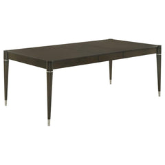Enhance your dining experience with this contemporary dining table in a stunning ash brown finish. Crafted with a combination of engineered wood, Asian hardwood, and ash veneer, it delivers durability and timeless elegance. The table extends from 63 inche