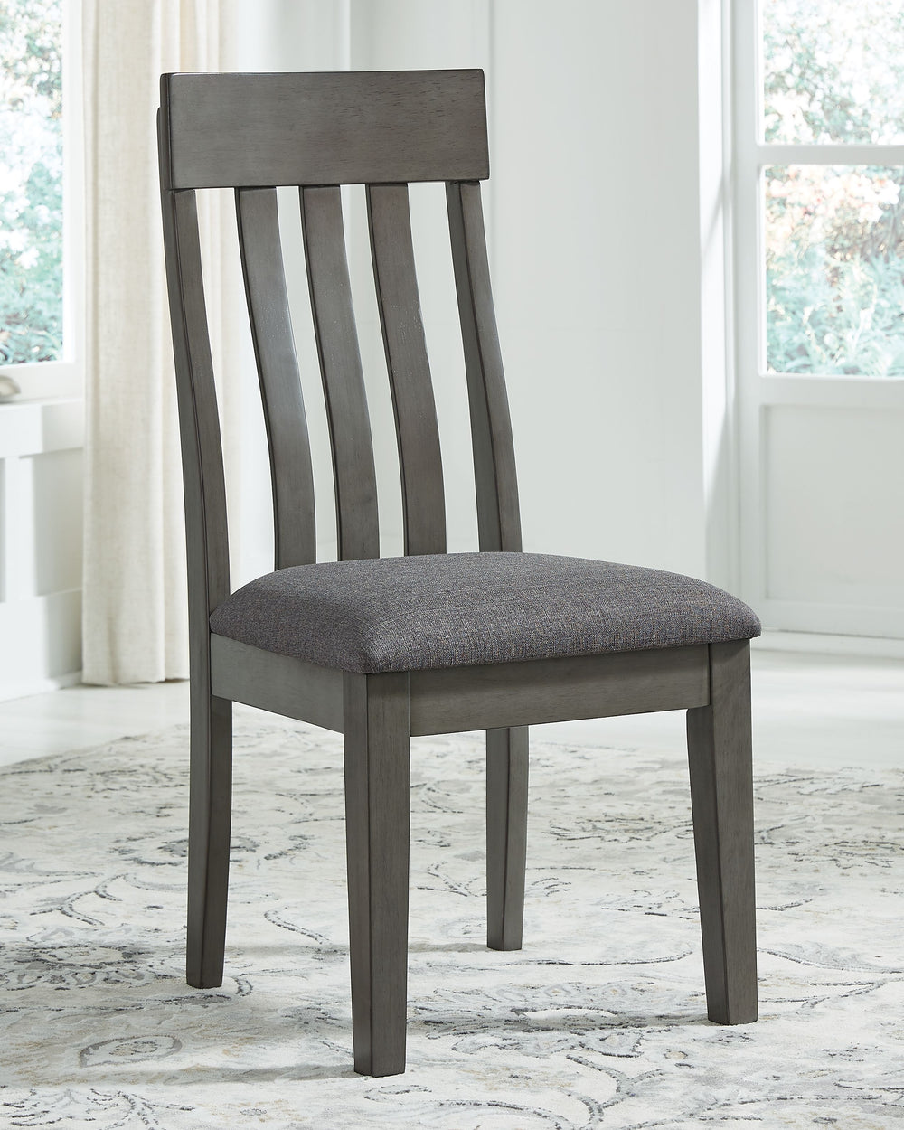 Cool and on-trend. This upholstered dining chair sports a two-tone gray look for a contemporary-yet-casual feel. The cushioned foam seat in a gray textural fabric pairs seamlessly with the antiqued gray finish, while the contoured comb-back design adds a 