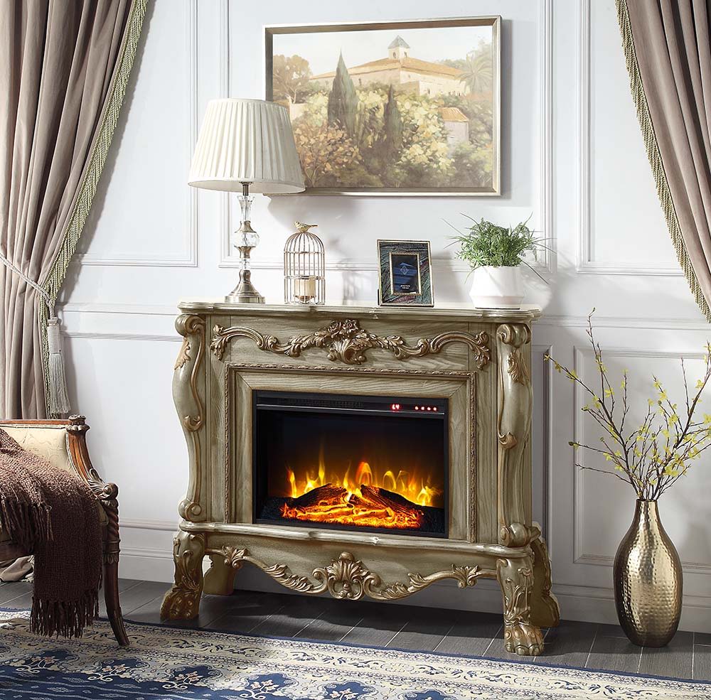 Add warmth and comfort to any room in your home with the impressive Dresden fireplace in a gold patina finish. The grand fireplace features floral moldings throughout the piece. Sitting on carved claw feet or added elegance. The fireplace features a touch