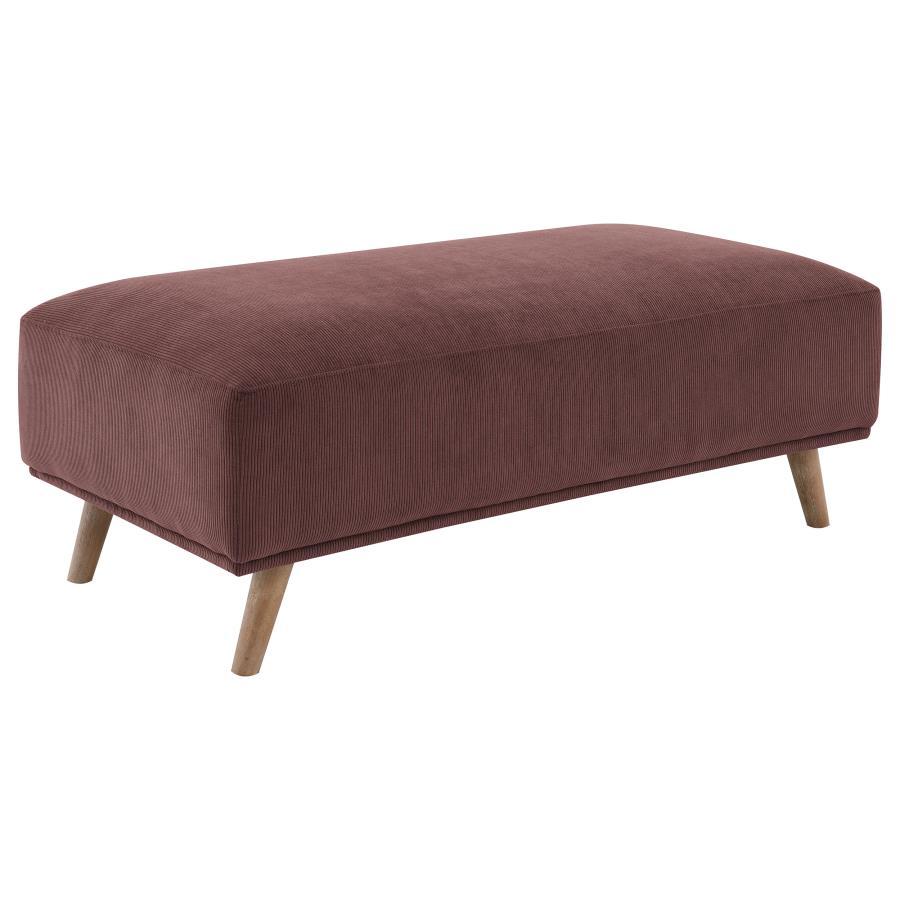 Complete your inviting sitting area with the richness of a modern ottoman. It showcases red wine upholstery, adding depth and the richness of a lovely jewel tone to your living room. It features a rectangular silhouette with plush padding, offering a foot