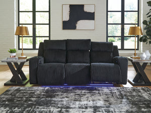  meet irresistible modern function. Your living room gets a cozy-cool upgrade with this power reclining sofa. Curl up in its ultra-chic corded upholstery and recline with one-touch controls. Is it movie night or game time? With ambient L