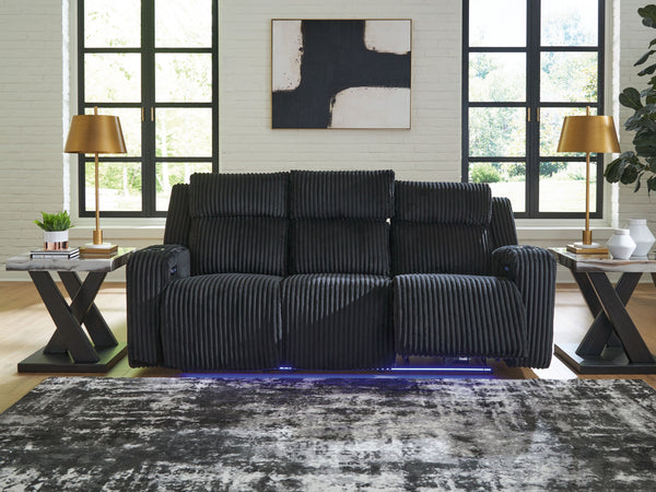  meet irresistible modern function. Your living room gets a cozy-cool upgrade with this power reclining sofa. Curl up in its ultra-chic corded upholstery and recline with one-touch controls. Is it movie night or game time? With ambient L