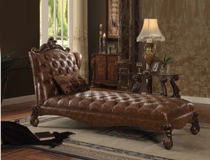Create an elegant, traditional design in your room with the Versailles Chaise. A hand-crafted piece inspired from the luxurious designs of the past, this stunning piece comes in a rich cherry oak finish and features a two tone, light brown, PU button-tuft