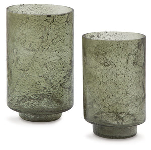 Create an even cozier ambiance in your home with this candle holder set. Their green sanded glass makes the soft glow of electric or real candles all the more beautiful. Stunning when displayed as a duo or standing alone, these holders are a simple way to