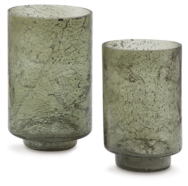 Create an even cozier ambiance in your home with this candle holder set. Their green sanded glass makes the soft glow of electric or real candles all the more beautiful. Stunning when displayed as a duo or standing alone, these holders are a simple way to