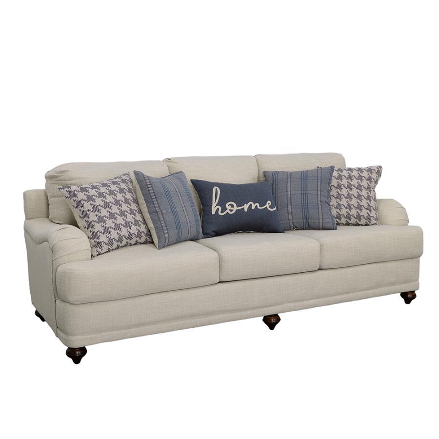 Farmhouse inspiration delivers a fresh, stylish look to a transitional space with this exceptional sofa. With tailored English arms and turned legs offering a contrasting espresso finish, this sofa shines with a light grey linen-like upholstered cover. Th