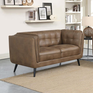  designed as an updated take on the classic Chesterfield style silhouette including grid tufted seats and backs along with welt trim details. Upholstered in a