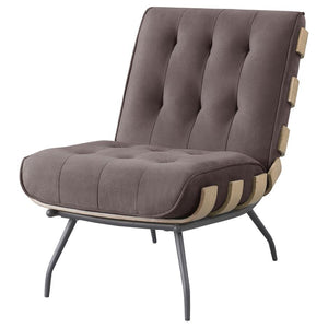  or family room. This accent chair features a reworked outdoor lounge chair motif with a seamed and tufted back cushion and an oversized s