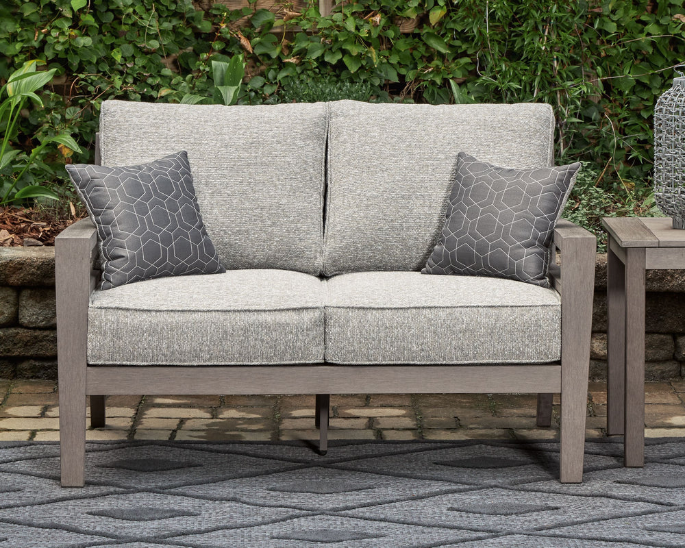 This loveseat is a stylish outdoor piece with staying power. Built for longevity with Weatherwood, an engineered resin polymer with the appearance of wood, it indulges you in contemporary design without sacrificing durability. Stunning form and canâ€™t-mi
