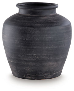 Celebrate the artisanal character of ceramics with this vase. Its distressed black finish has a time-worn, weathered appeal, offering the look of the past with a modern feel. The vase-'s neutral tone makes it a go-to for all seasons, allowing you to stage