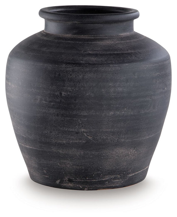 Celebrate the artisanal character of ceramics with this vase. Its distressed black finish has a time-worn, weathered appeal, offering the look of the past with a modern feel. The vase-'s neutral tone makes it a go-to for all seasons, allowing you to stage