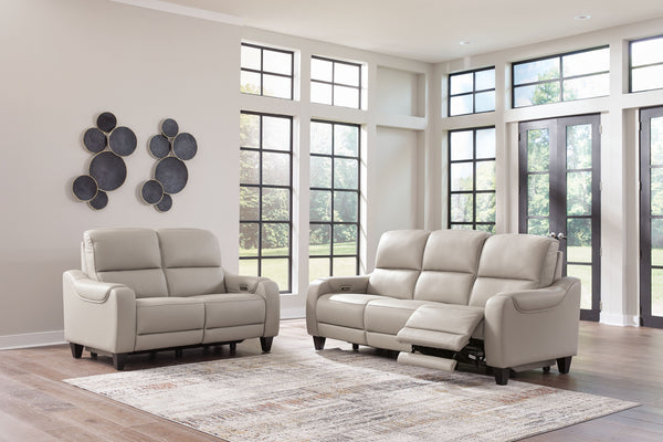 This power reclining sofa with matching loveseat puts a sleek twist on laid-back living. It satisfies your desire for comfort without being bulky in design, thanks to subtly incorporated one-touch reclining and adjustable headrests. With chic exposed legs