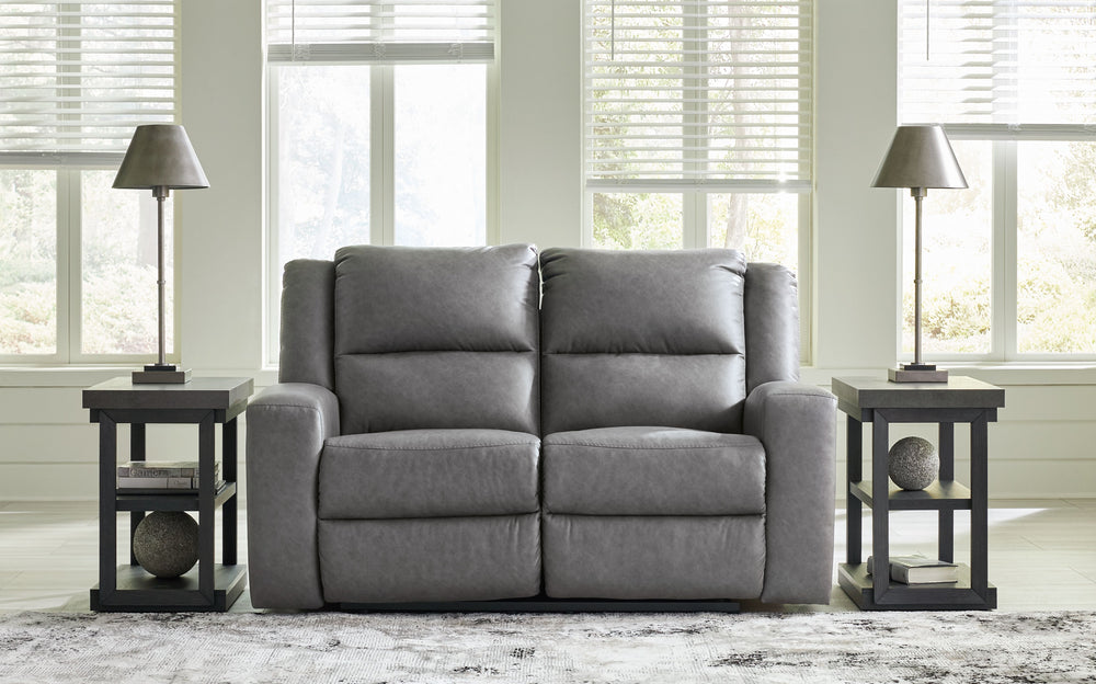 This reclining loveseat appeals to your love for feature-filled furniture, all while maintaining a clean-lined and contemporary design. Pop-out storage and cup holders keep essentials close when you need them and tuck away easily when you donâ€™t. Time to