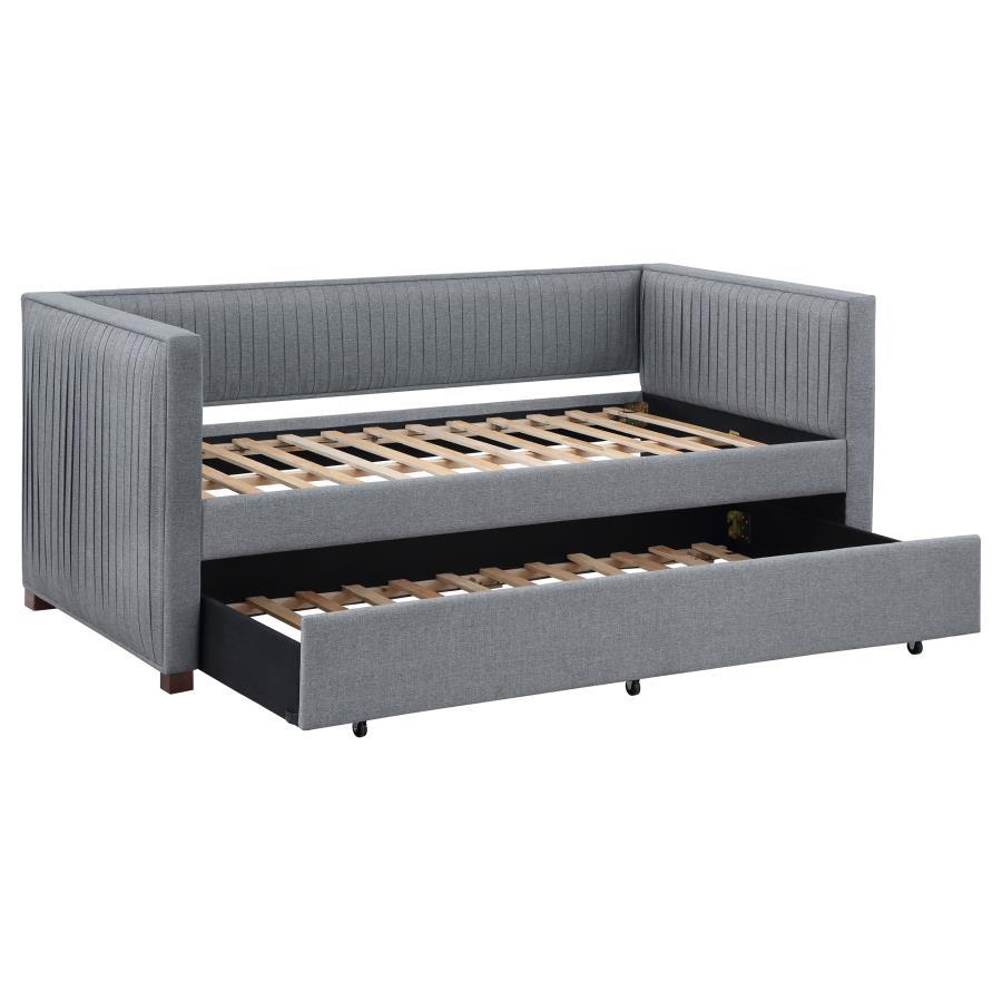 A gray fabric, pleated and overlapping along the surface of this twin daybed and trundle set, create a textured appearance against the clean straight lines. The narrow arms and backrest invite you to get creative with your own accent pillows and throws, o