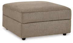 Complete your at-home retreat with this casually chic ottoman. The luxe herringbone chenille upholstery is indulgently plush to the touch. A removable top conceals additional storage space and cup holders. With its clean-lined construction, this ottoman s