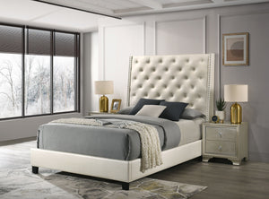 Indulge in the elegance and regal charm of our luxurious upholstered bed frame. Wrapped in a sophisticated pearl faux leather, this bed frame features a plush, tufted headboard with subtle nailhead accents, offering a touch of luxury for any modern bedroo