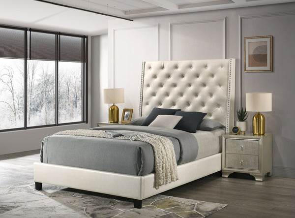 Indulge in the elegance and regal charm of our luxurious upholstered bed frame. Wrapped in a sophisticated pearl faux leather, this bed frame features a plush, tufted headboard with subtle nailhead accents, offering a touch of luxury for any modern bedroo