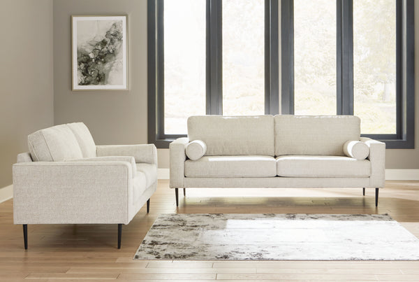 Simple comfort meets modern function in this living room set. An apt addition to apartments and other small spaces, the slim-profiled piece welcomes you with its cozy character. A subtle chevron pattern on the cushions refreshes the classic neutral hue, e