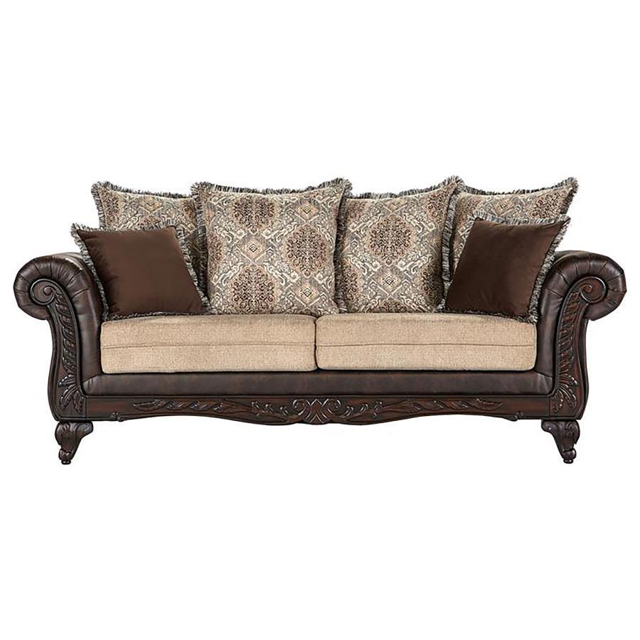 Plush indulgence meets traditional design in a compelling upholstered sofa. Its regal stance showcases dramatic rolled arms, complete with carved enhancements across their fronts and the sofa-'s apron. The carvings continue on curvy feet, while dark brown