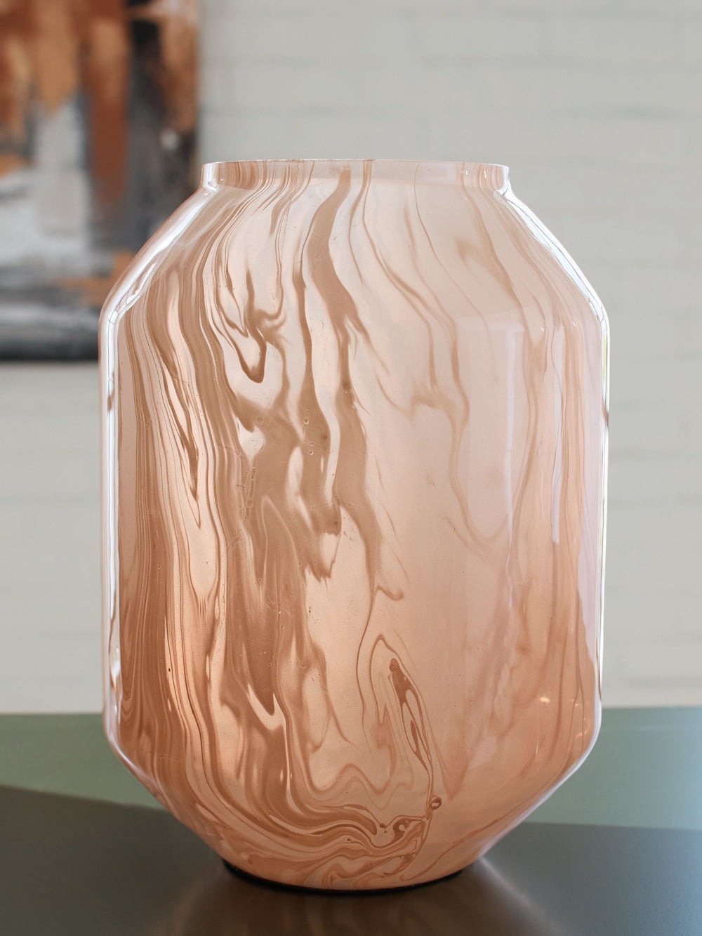 Form and function at its finest, this vase has a chic sensibility that elevates your decor. Its contemporary silhouette is topped in a blush pink finish and flowing swirls, complementing a myriad of palettes with understated elegance. If you-'re seeking f