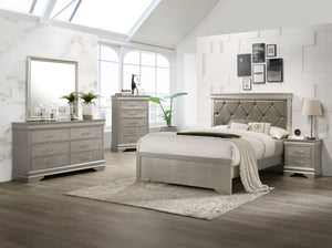 This bedroom set embodies a refined elegance with its soft silver hue and luxurious textures, perfect for creating a serene and sophisticated sanctuary. The centerpiece is a sumptuous bed framed by a headboard with diamond-tufted detailing, offering a tou