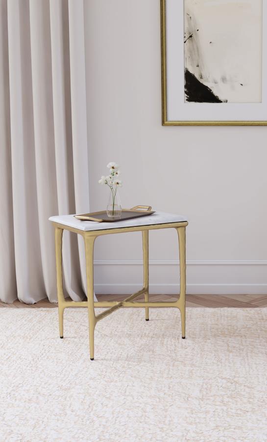 Elevate your living space with the refined elegance of this rectangular side table, where modern luxury meets sculptural design. A genuine white marble top rests on a striking, hand-hammered steel frame finished in a luxurious gold. The organic texture of