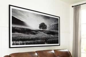  this wall art has a refined look with a restful feel. It captures a landscape with rolling hills