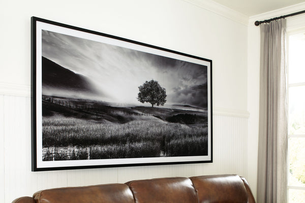 this wall art has a refined look with a restful feel. It captures a landscape with rolling hills