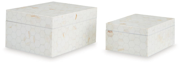 Looking for a casually cool home accent? This set of boxes stacks up beautifully. A hexagonal mosaic design and cream finish bring a laid-back element to your decor. What a stylishly effortless way to refresh your shelves and tabletops.<br><br><b>Addition
