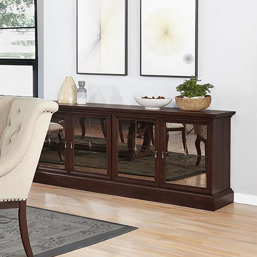 Complete your Brockway collection dining ensemble with the stylish, refined presence of this wood server. Offering four mirrored doors, the server opens to reveal superb storage space for dinner and serveware. Crafted in wood, the sideboard features a ric