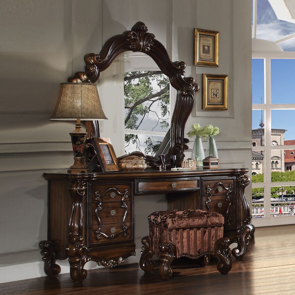 The Versailles vanity stool is the perfect accent to create the style of royalty your bedroom has been needing. This vanity stool crafted in wood with cherry oak finish was inspired by old European design with an upholstered tight seat cushion with welted