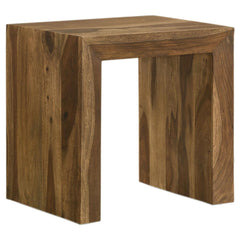 This rectangular end table pairs modern simplicity with rustic charm, featuring a robust U-shaped silhouette and clean lines. Crafted from sustainable solid sheesham wood, its layered auburn finish highlights the natural grain patterns, adding depth and c