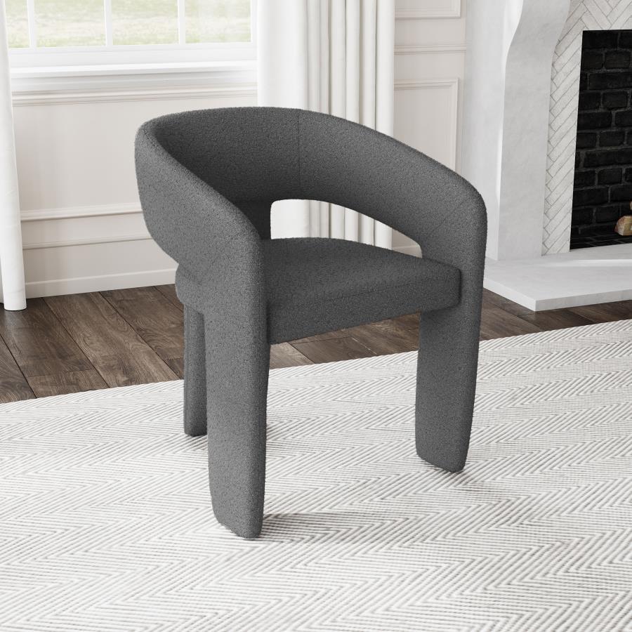 Refresh the look and feel of a modern dining room with a contemporary armchair. Stylish presence is created with its rounded silhouette, pairing a keyhole design with sloping arms for airy ambiance. Three wide legs provide excellent support, while foam cu