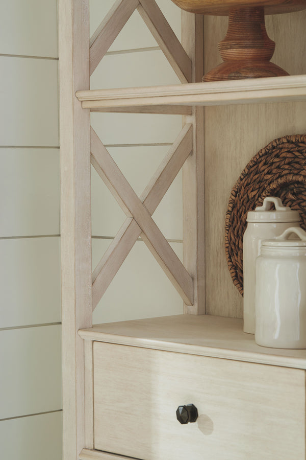  decorations and more? This tall three-shelf display cabinet is a dream come true. The textured antiqued white finish provides a perfect backdrop for presentation. For the items you want to hide