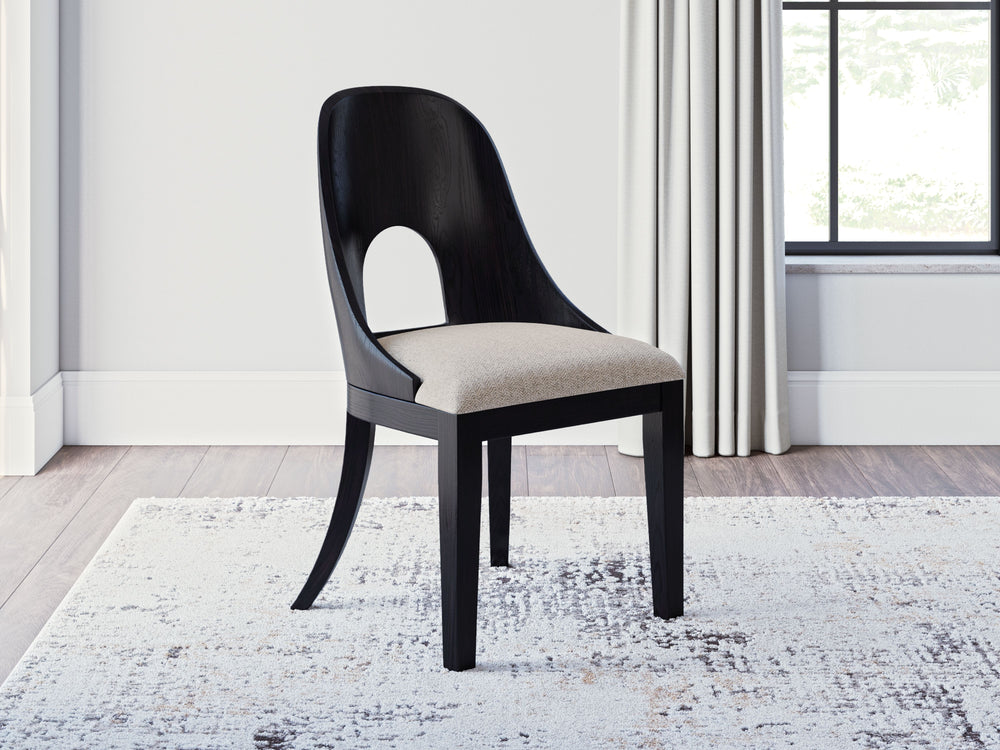 Inspired by art deco design, the Rowanbeck home office desk chair makes a lasting impression in a simply stunning way. The magnificence of its trend-right curved silhouette is enhanced with a rich layered black finish over a textured wood grain finish. It