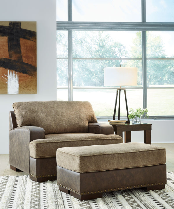 Oversized but not over-the-top, this chair and ottoman are perfect for those who love the look of leather. Two textural tones provide twice the style and comfortâ€”and incorporate an added layer of visual interest. The piece is punctuated by a subtle band