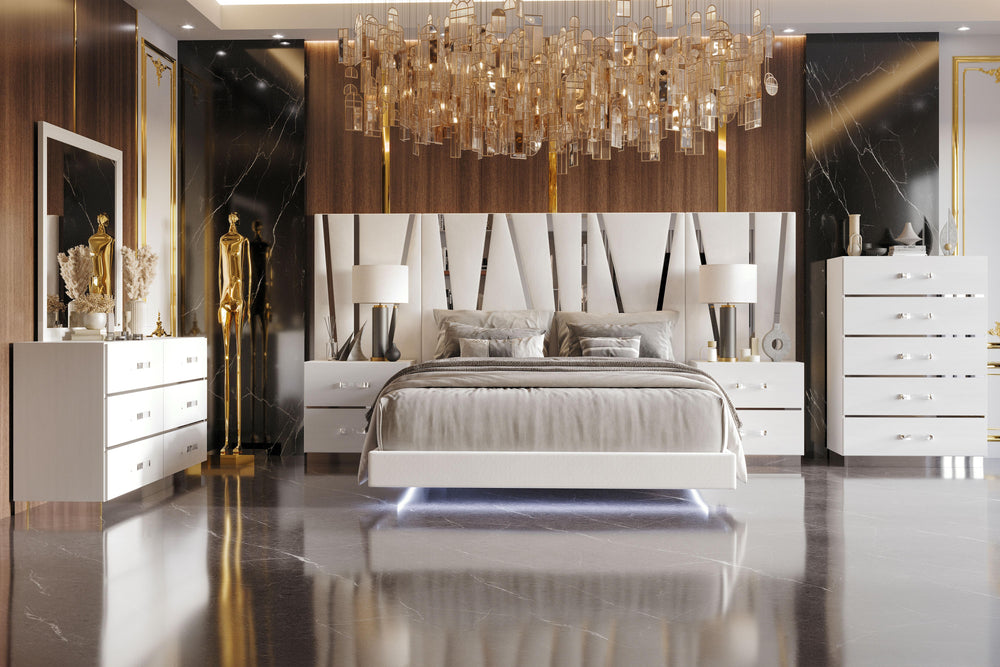 Transform your bedroom into a luxurious retreat with the Europa 8 Piece Bedroom Set. This exquisite collection includes a sophisticated panel bed paired with a stunning dresser, mirror, two nightstands with back panels, and a chest. The modern design feat