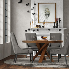 Bring a touch of global-inspired elegance to your dining room with the 60 Inch Round Dining Table. This handcrafted table is made from solid mango, giving it a unique aesthetic with natural variations of color, wood grain, and knots. The round table is pa