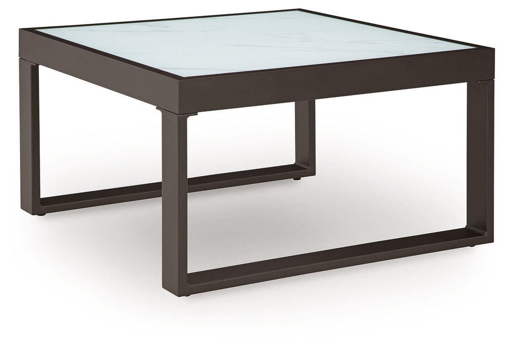 Sleek, contemporary style meets outdoor living in this coffee table. Its clean-lined black aluminum frame expertly balances good looks and longevity. A stunning top provides the natural stone look you love, while its glass construction weathers the season