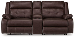 Elevate the everyday with this power reclining sectional. With easy one-touch reclining and spacious seating, the piece offers relaxation and unparalleled coziness. Its faux leather upholstery is comfortably practical and beautifully enhanced with stylish