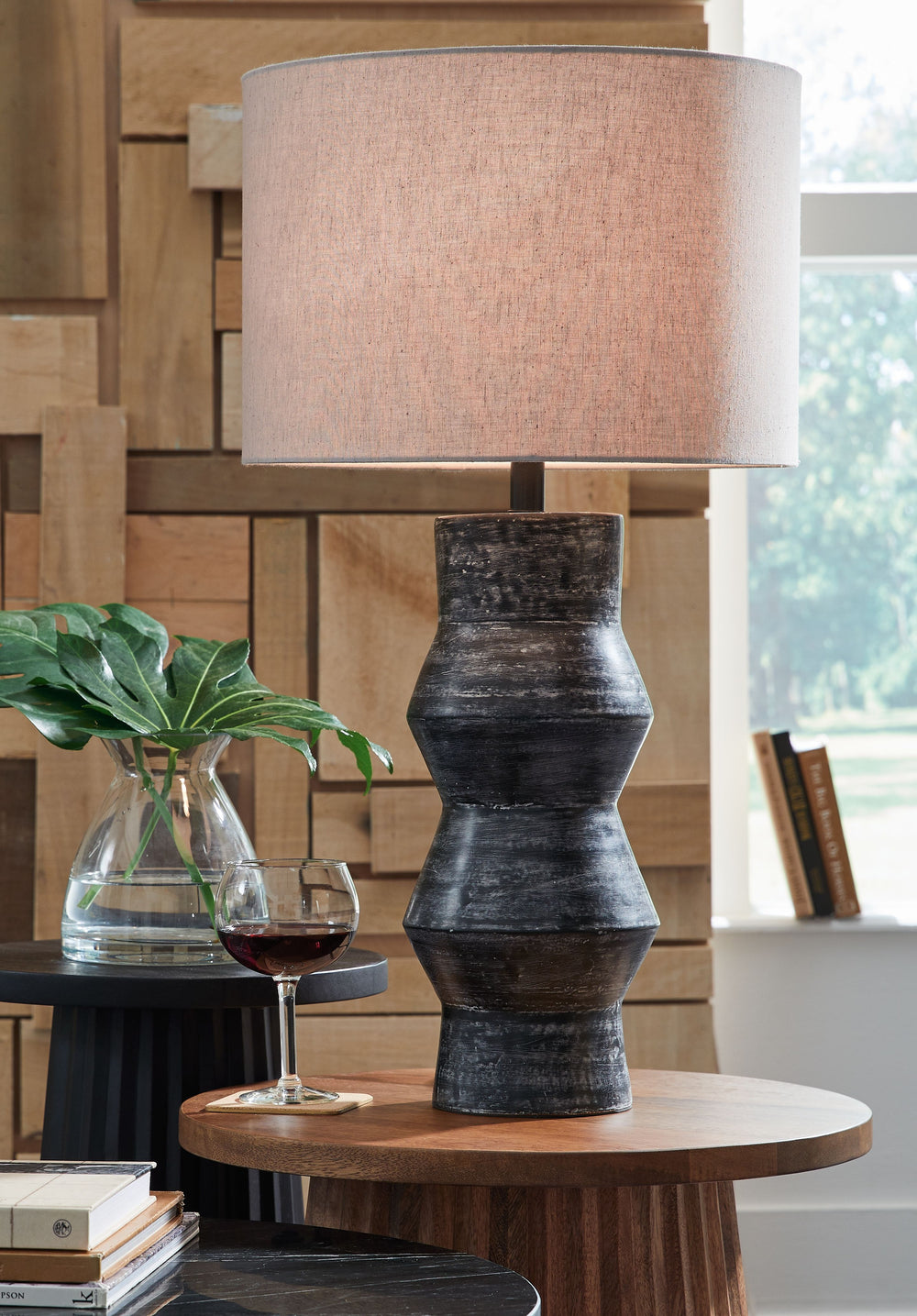 Add a touch of casually cool style to your home with this table lamp. The terra cotta base sports a black rubbed finish that effortlessly complements a wide range of decor and color palettes. This versatile and illuminating choice is sure to be the glowin