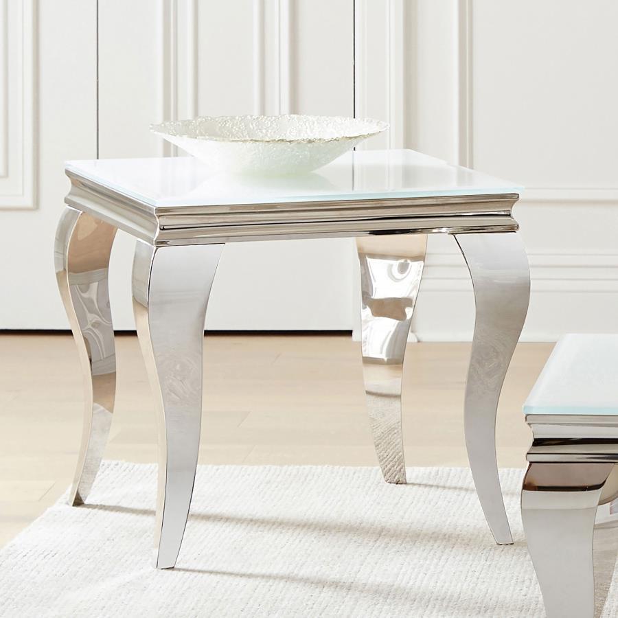 This end table exudes modern glam with a tempered beveled glass top and polished stainless steel cabriole legs. The reflective finish and gracefully curved Queen Anne style legs deliver timeless elegance and a majestic ambiance, perfect for elevating refi