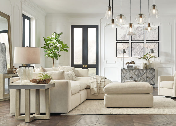 Down with uptown style. This sectional and ottoman goes to town with a high-design aesthetic, sleek sophistication and sumptuous comfort that are temptingly affordable. Wide track arms, softened by plush side pillows, offer a welcoming look and feel, whil
