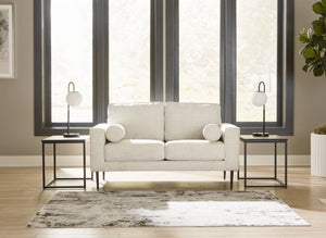  this slim-profiled piece welcomes you with its cozy character. A subtle chevron pattern on the cushions refreshes the classic neutral hue