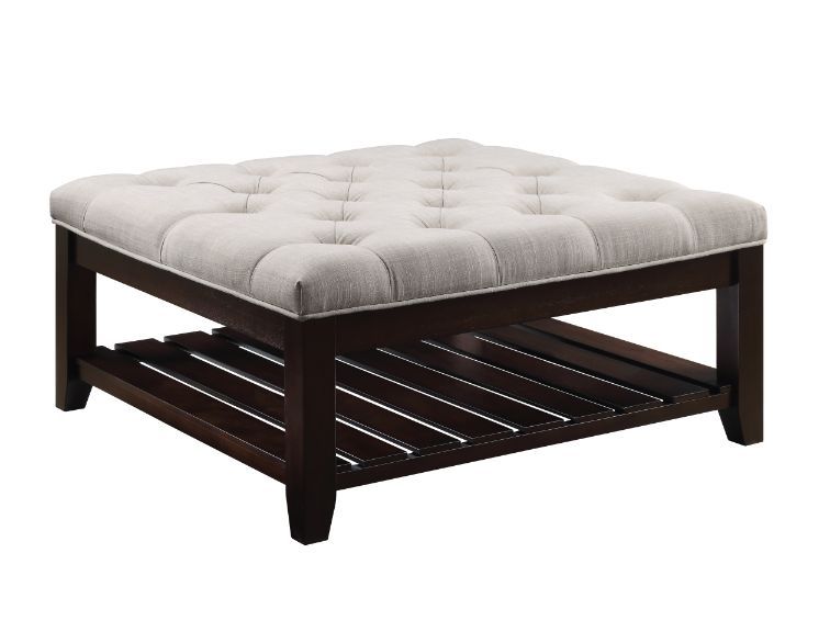 Add flexible designs and versatile functions to your seating arrangement. The Aizen Cocktail Ottoman has a durable wooden frame with a slatted tier shelf. Button tufted cushion above the frame maintains stylish comfort. This brilliant piece offers a extra